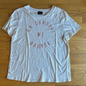 Graphic tee with embroidered quote